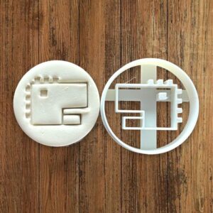 Round pixel art dinosaur cookie cutter for baking shortbread biscuits, fondant shaping, sugar paste decorating, retro video game dinosaur cake decoration, pastry crafting tool