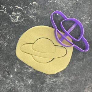 Planet shape cookie cutter for baking shortbread biscuits, fondant cutting, sugar paste shaping, space themed cake decoration, galaxy inspired pastry crafting, homemade dessert