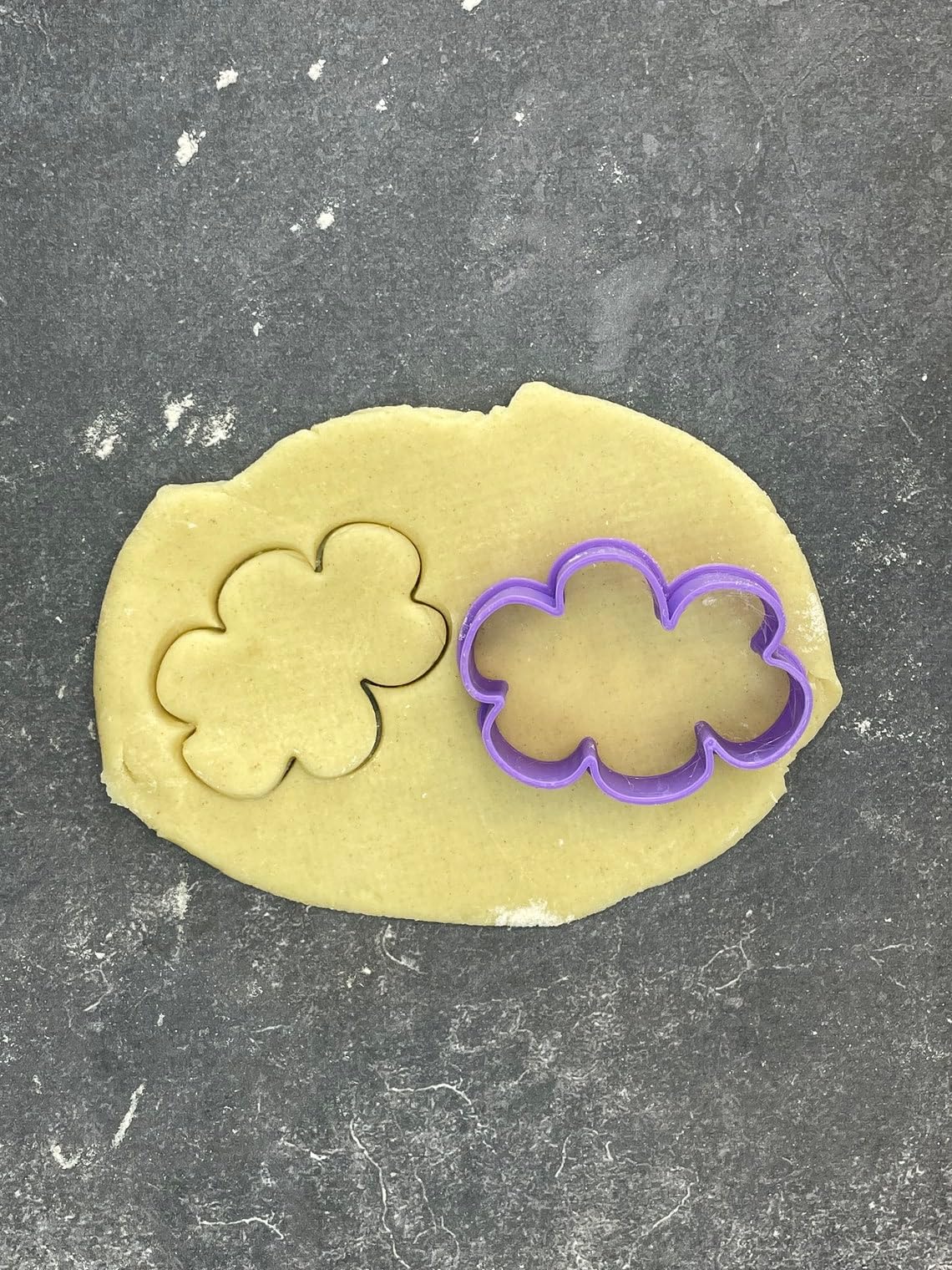 Small cloud shape cookie cutter for baking shortbread biscuits, fondant cutting, sugar paste shaping, sky themed cake decoration, dreamy pastry crafting, homemade dessert decorating