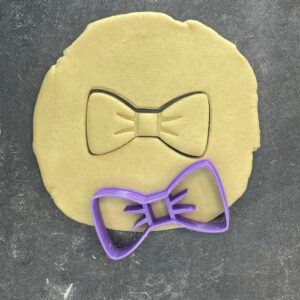 Bow tie shape cookie cutter for baking shortbread biscuits, fondant cutting, sugar paste shaping, gentleman theme cake decoration, birthday party pastry crafting, homemade dessert tool